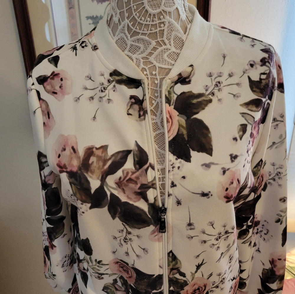 Zip up top with rose petal design.